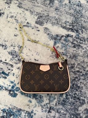 Monogram Mini Pochette with Pink Trim and Red Accent